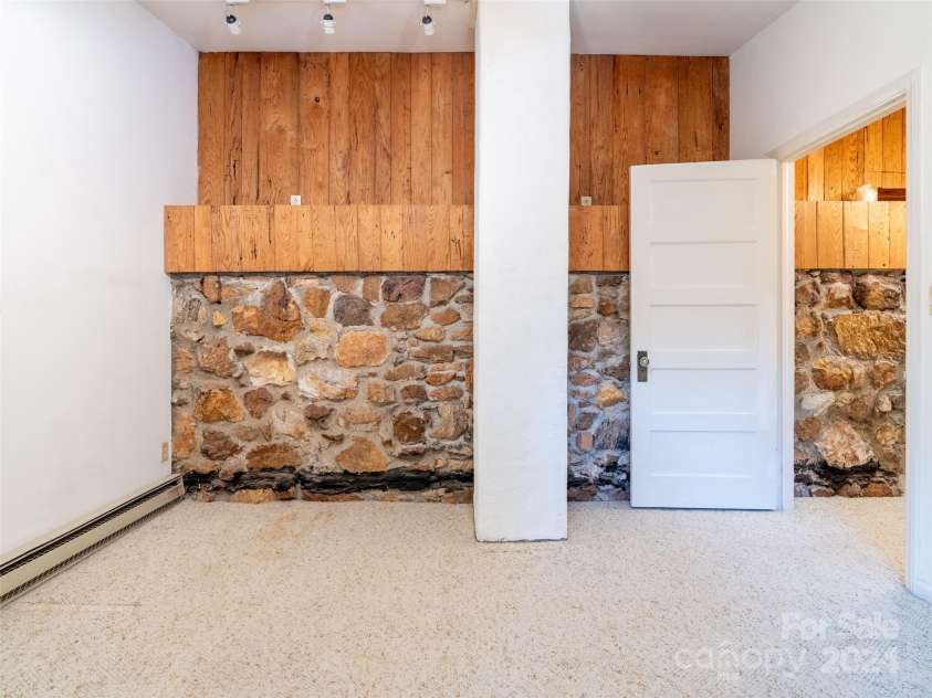 127 Springside Road, Asheville, NC 28803.  MLS# CAR4171365, YatesRealty ID 8316. Bedroom with stone accents