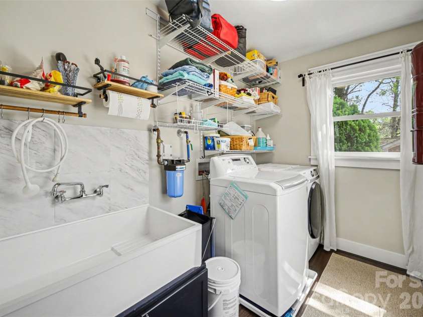 4629 Halstead Drive, Charlotte, NC 28209.  MLS# CAR4358166, YatesRealty ID 8322. Laundry with large utility sink perfect for pets or projects