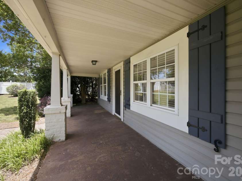 19428 Zion Avenue, Cornelius, NC 28031.  MLS# CAR4314350, YatesRealty ID 8324. Covered front porch