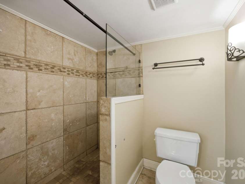19428 Zion Avenue, Cornelius, NC 28031.  MLS# CAR4314350, YatesRealty ID 8324. Full bathroom with custom tile shower