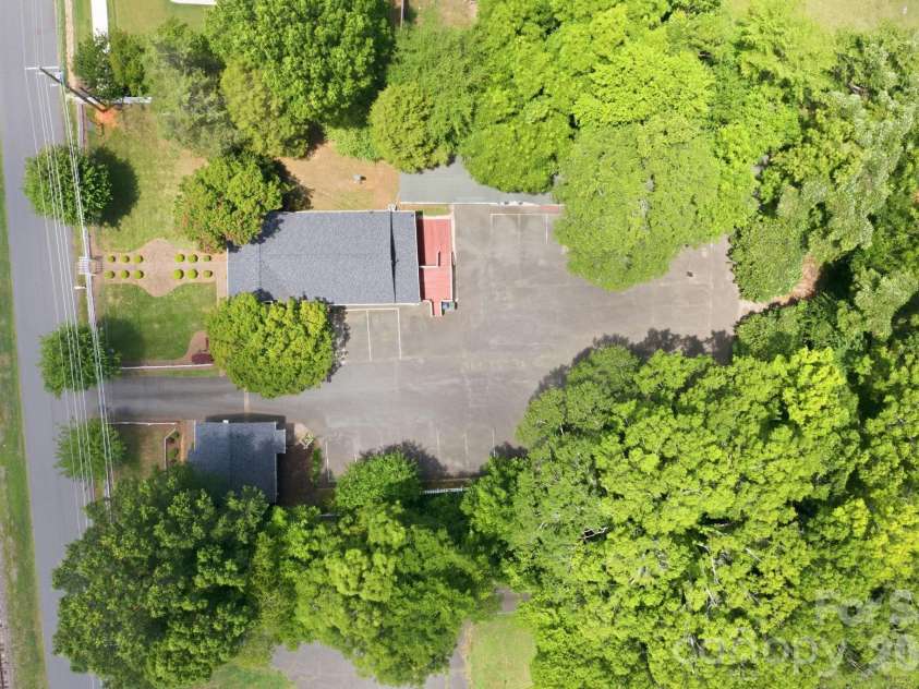 19428 Zion Avenue, Cornelius, NC 28031.  MLS# CAR4314350, YatesRealty ID 8324. One Acre!