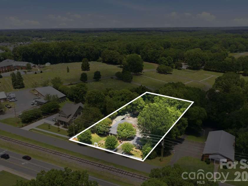 19428 Zion Avenue, Cornelius, NC 28031.  MLS# CAR4314350, YatesRealty ID 8324. One acre with multiple home, studio and detached garage!