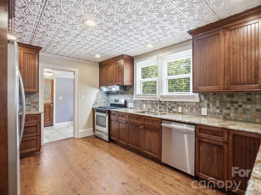 19428 Zion Avenue, Cornelius, NC 28031.  MLS# CAR4314350, YatesRealty ID 8324. Updated Kitchen feat. custom cabinets & granite countertops