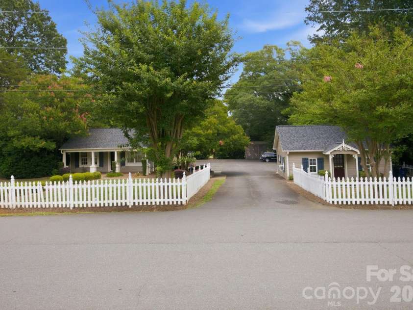 19428 Zion Avenue, Cornelius, NC 28031.  MLS# CAR4314350, YatesRealty ID 8324. White picket fence and a detached Studio!