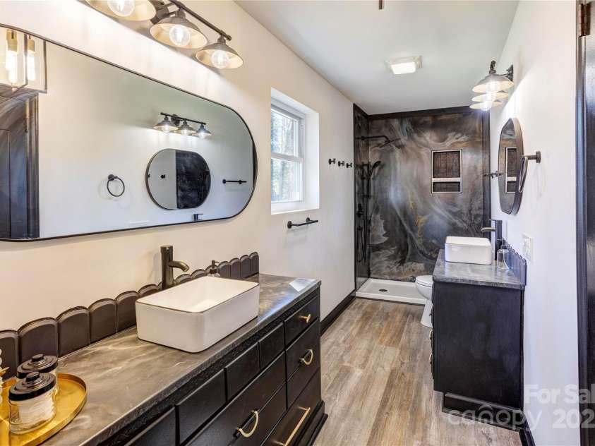 308 Dakota Street, Kannapolis, NC 28083.  MLS# CAR4227333, YatesRealty ID 8330. Beautiful primary bath with dual vanities. Exterior wall is double insulated for winter months.