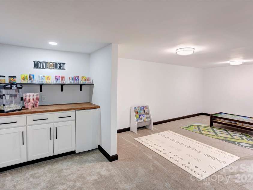 308 Dakota Street, Kannapolis, NC 28083.  MLS# CAR4227333, YatesRealty ID 8330. Concession area in basement with beverage fridge.