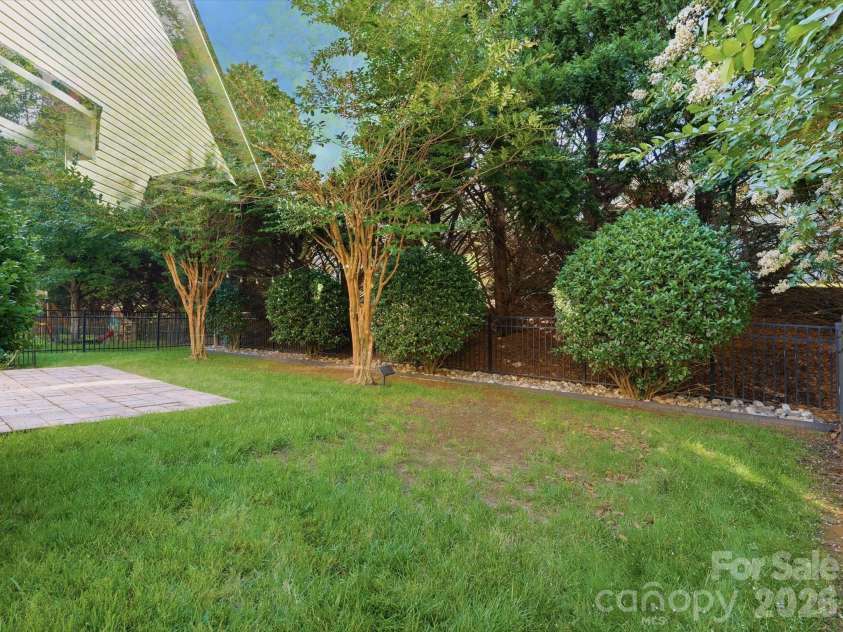 1022 Fleming Lane, Matthews, NC 28104.  MLS# CAR4375800, YatesRealty ID 8336. Back yard