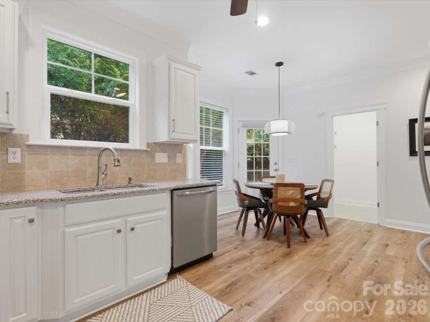 1022 Fleming Lane, Matthews, NC 28104.  MLS# CAR4375800, YatesRealty ID 8336. Kitchen with view to laundry and back door