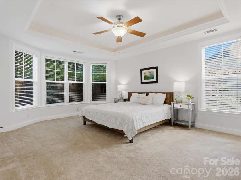 1022 Fleming Lane, Matthews, NC 28104.  MLS# CAR4375800, YatesRealty ID 8336. Primary bedroom with king bed