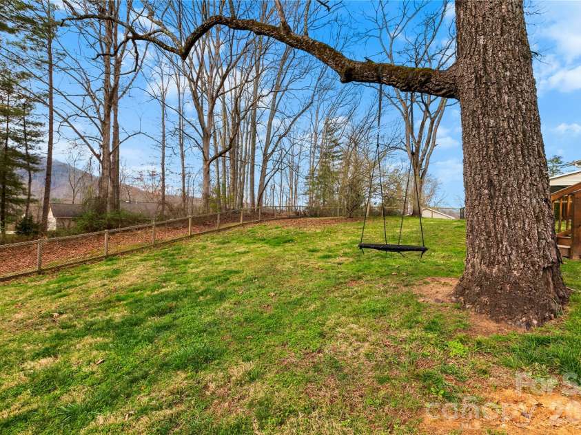296 Souther Road, Fletcher, NC 28732.  MLS# CAR4357298, YatesRealty ID 8337. Spacious level back yard.