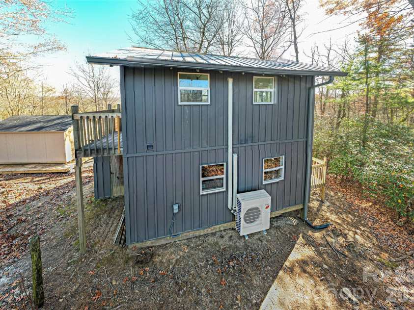 426, 428 Weaver Creek Road, Brevard, NC 28712.  MLS# CAR4322067, YatesRealty ID 8338. This home features metal board and batten siding!