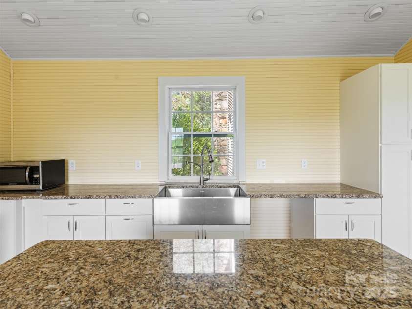 443 Shand Street, Saluda, NC 28773.  MLS# CAR4247244, YatesRealty ID 8346. Detached kitchen