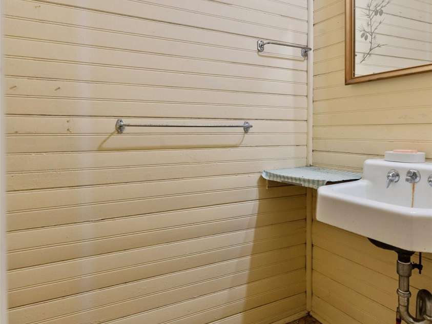 443 Shand Street, Saluda, NC 28773.  MLS# CAR4247244, YatesRealty ID 8346. Half bath in downstairs bedroom