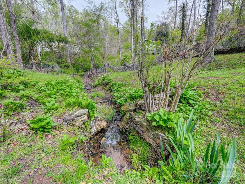 417 Royal Pines Drive, Arden, NC 28704.  MLS# CAR4247214, YatesRealty ID 8347. Creek/Waterfall