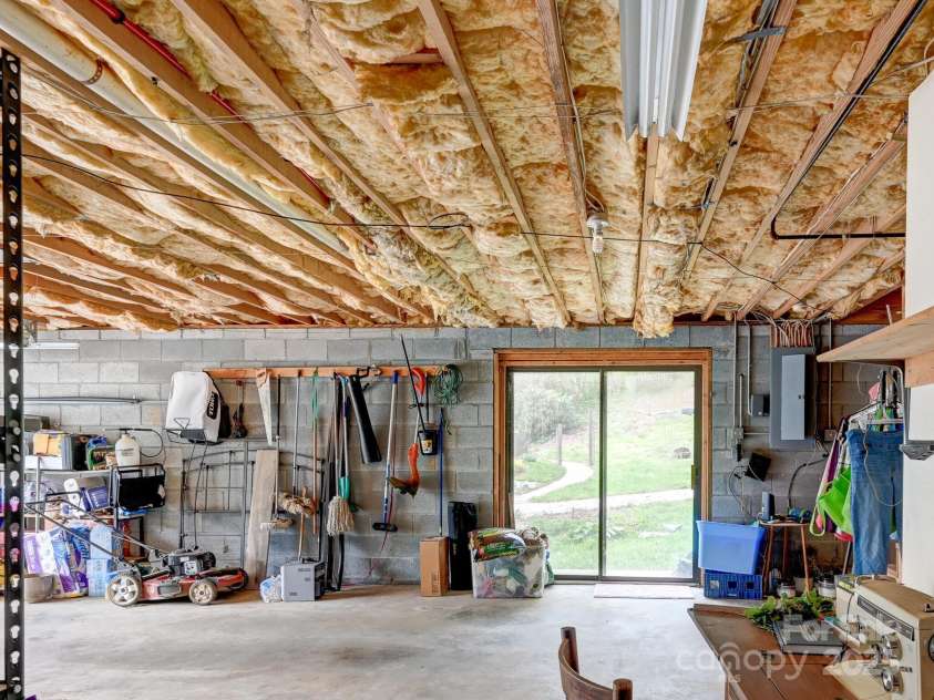 417 Royal Pines Drive, Arden, NC 28704.  MLS# CAR4247214, YatesRealty ID 8347. Garage/basement level side access