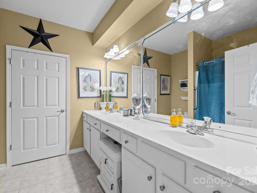14869 Santa Lucia Drive, Charlotte, NC 28277.  MLS# CAR4245017, YatesRealty ID 8354. Primary Bathroom with Dual Vanities and walk in shower