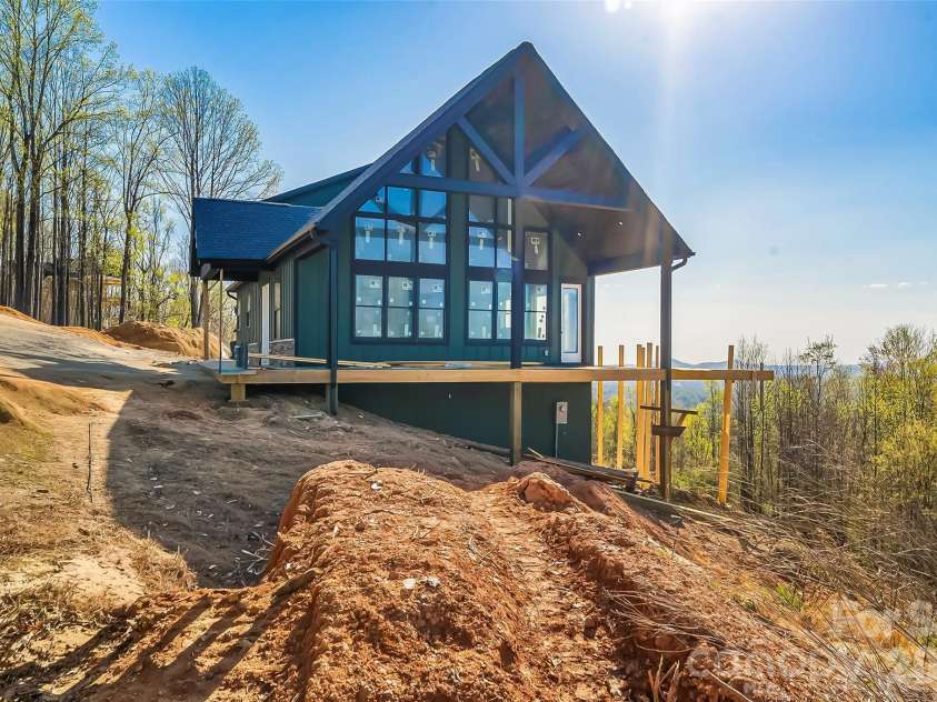 4898 Soaring Top Lane, Lenoir, NC 28645.  MLS# CAR4364265, YatesRealty ID 8361. Side elevation with long range mountain views