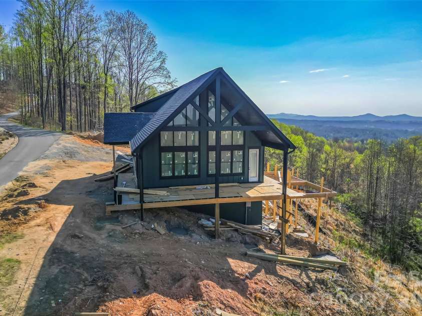 4898 Soaring Top Lane, Lenoir, NC 28645.  MLS# CAR4364265, YatesRealty ID 8361. Side elevation with long range mountain views