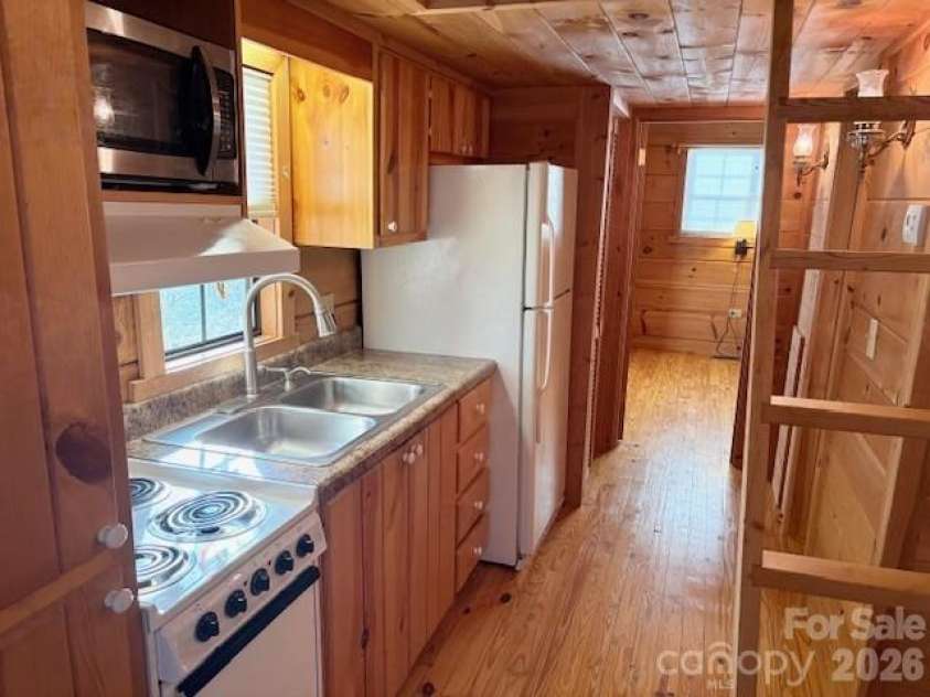 129 Mallard Loop, Waynesville, NC 28785.  MLS# CAR4335027, YatesRealty ID 837. Kitchen & hallway to bedroom