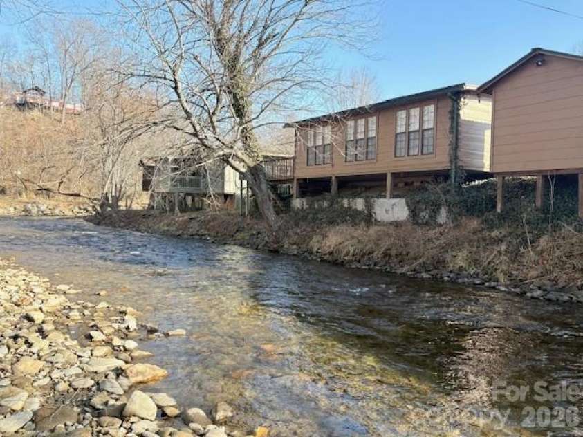 129 Mallard Loop, Waynesville, NC 28785.  MLS# CAR4335027, YatesRealty ID 837. Rushing creek behind home