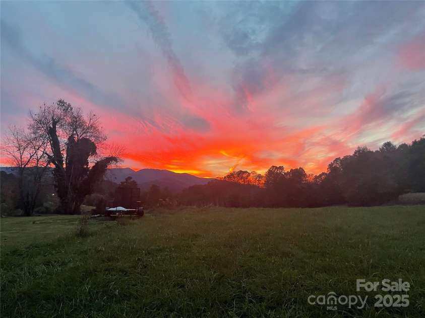 115 Grindstaff Road, Bakersville, NC 28705.  MLS# CAR4199557, YatesRealty ID 8377. From behind the house near chicken coop