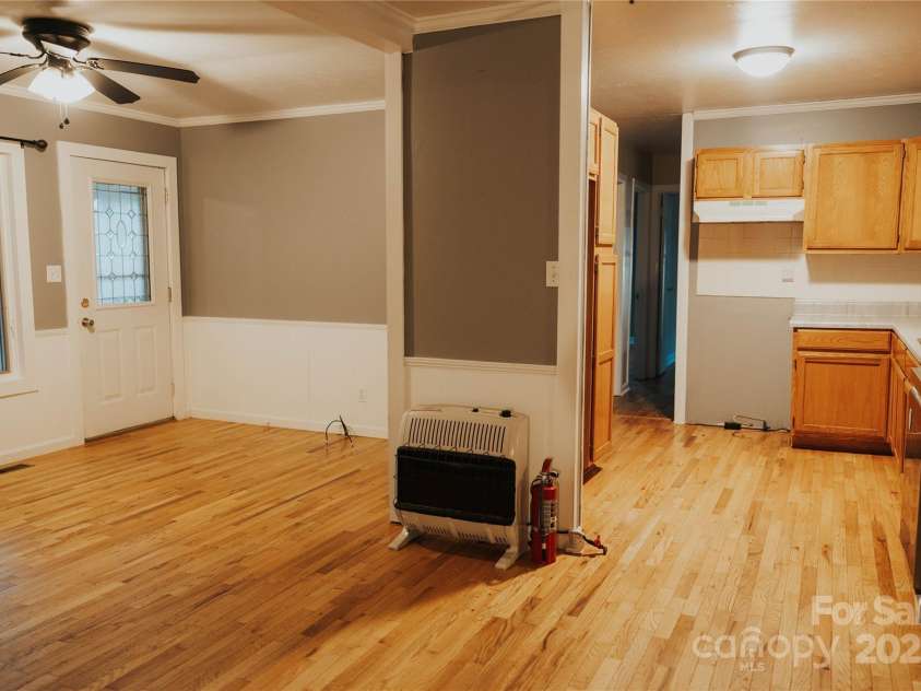 115 Grindstaff Road, Bakersville, NC 28705.  MLS# CAR4199557, YatesRealty ID 8377. Living room and Kitchen