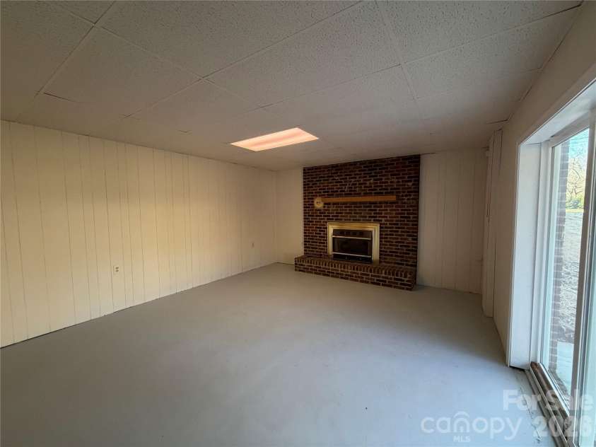 424 Holland Drive, Statesville, NC 28677.  MLS# CAR4335515, YatesRealty ID 838. Basement with fireplace