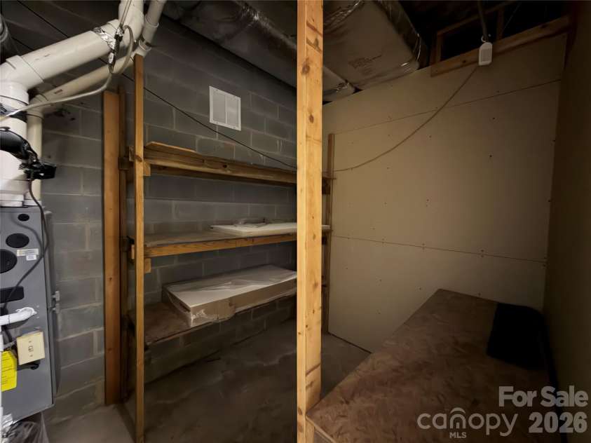 424 Holland Drive, Statesville, NC 28677.  MLS# CAR4335515, YatesRealty ID 838. Utlity room with storage 