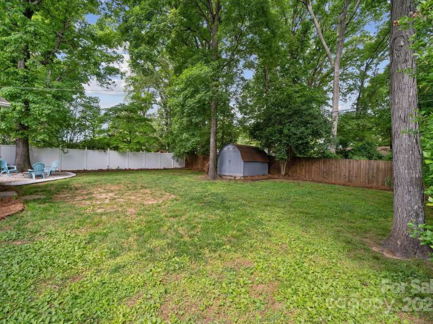3725 Dunwoody Drive, Charlotte, NC 28215.  MLS# CAR4245588, YatesRealty ID 8389. Huge, flat lot - already fenced in & comes with a shed!
