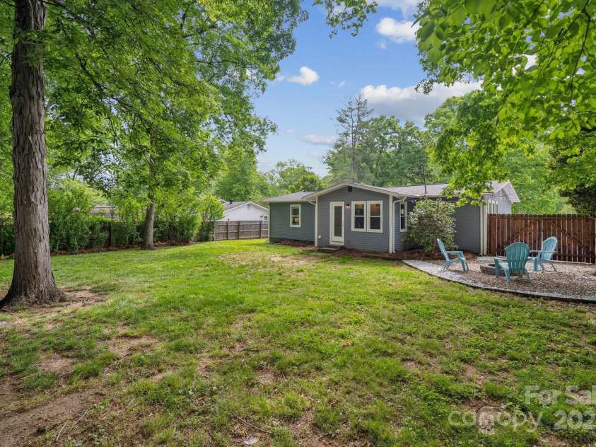 3725 Dunwoody Drive, Charlotte, NC 28215.  MLS# CAR4245588, YatesRealty ID 8389. Lovely firepit area in the back yard.
