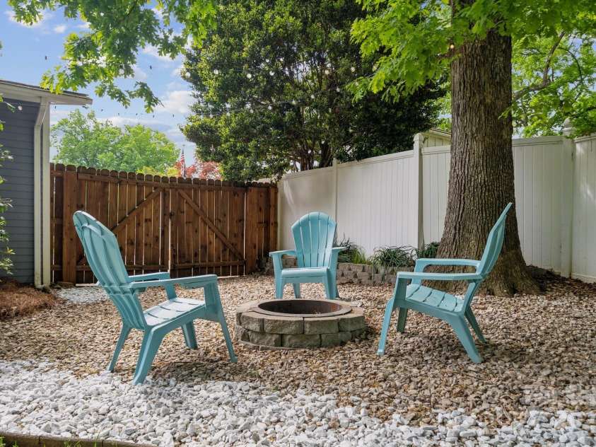 3725 Dunwoody Drive, Charlotte, NC 28215.  MLS# CAR4245588, YatesRealty ID 8389. Lovely firepit area in the back yard.