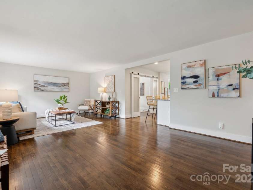 3725 Dunwoody Drive, Charlotte, NC 28215.  MLS# CAR4245588, YatesRealty ID 8389. You'll immediately notice the gleaming original hardwood floors & natural light that fills this open, spacious family room.