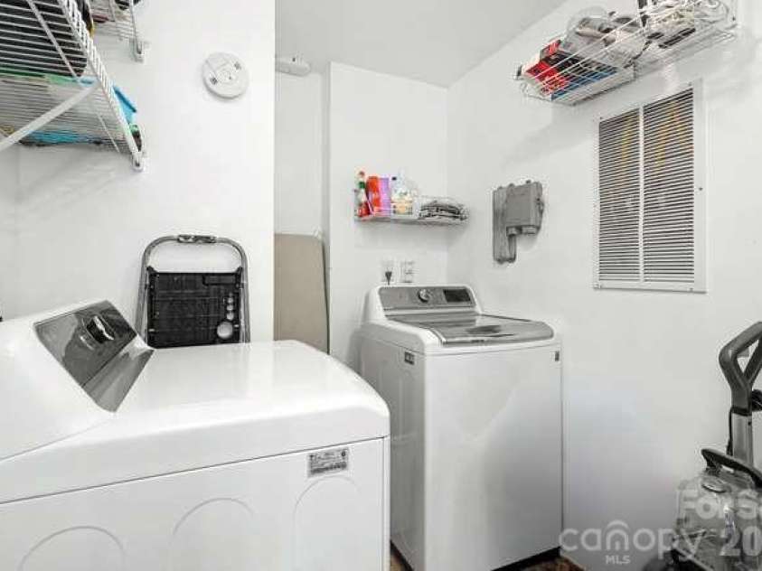 401 Church Street, Charlotte, NC 28202.  MLS# CAR4421548, YatesRealty ID 8389. In-unit laundry room has extra storage space.