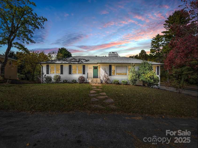 2115 Stoney View Court, Hendersonville, NC 28792.  MLS# CAR4310001, YatesRealty ID 839. Beautiful twilight view of 2115 N Stoney View Court Hendersonville 