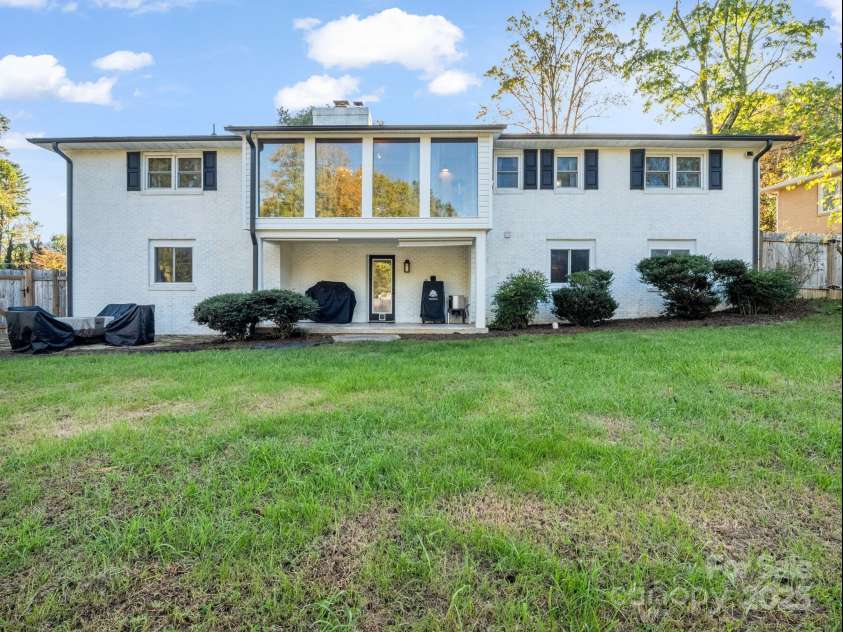 2115 Stoney View Court, Hendersonville, NC 28792.  MLS# CAR4310001, YatesRealty ID 839. Spacious fenced backyard with a covered patio and large windows that fill the home with natural light — perfect for outdoor entertaining or quiet evenings