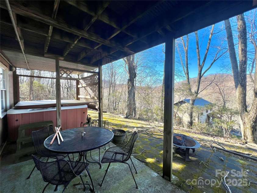305 Laurel Mountain Estates Drive, Todd, NC 28684.  MLS# CAR4222545, YatesRealty ID 839. Hot tub and lower level patio