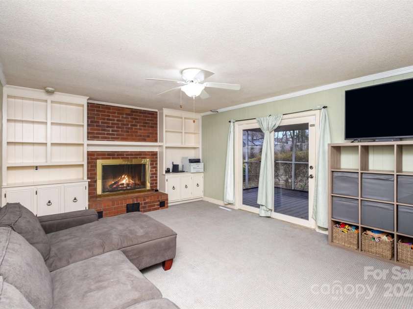 330 Regency Road, Salisbury, NC 28147.  MLS# CAR4215673, YatesRealty ID 8391. Family Room w/ built in and gas log fireplace.  Access to screened in porch
