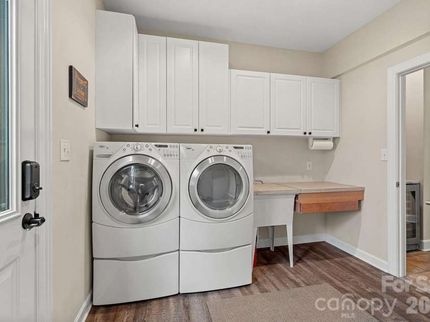 18019 Whispering Oaks Drive, Cornelius, NC 28031.  MLS# CAR4355958, YatesRealty ID 8397. Laundry Room with Rinse Off Shower
