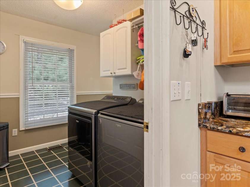 23 Dvga Court, Brevard, NC 28712.  MLS# CAR4285839, YatesRealty ID 8398. Laundry off Kitchen