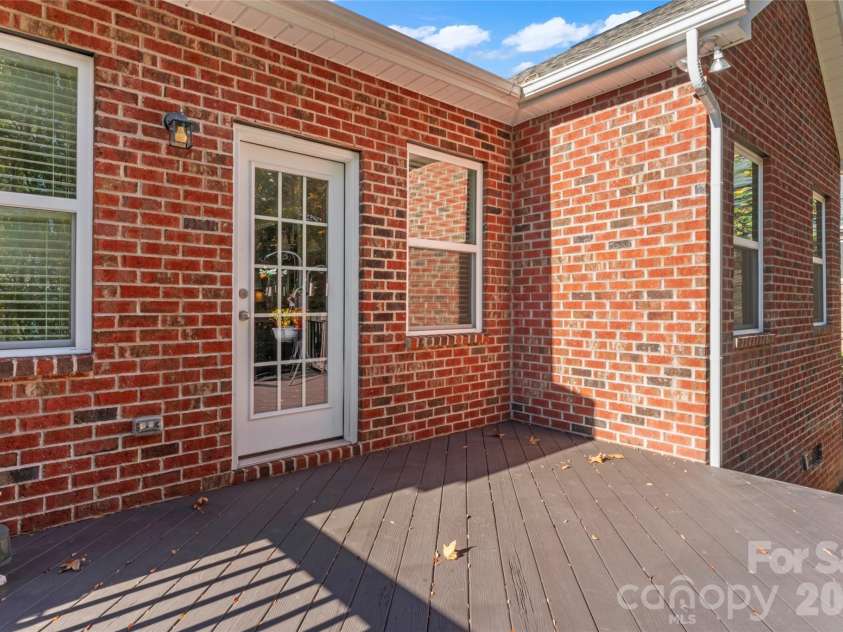 8015 Frances Haven Drive, Harrisburg, NC 28075.  MLS# CAR4318359, YatesRealty ID 8404. Newly Painted Deck
