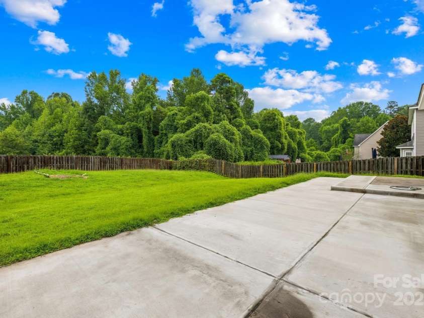 5025 Wicklow Drive, Gastonia, NC 28054.  MLS# CAR4291609, YatesRealty ID 8408. Expanded patio & backyard