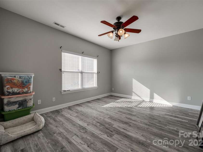 10071 Highland Creek Circle, Indian Land, SC 29707.  MLS# CAR4235607, YatesRealty ID 8409. Large Bedroom on Main Floor, Secondary Bed #5