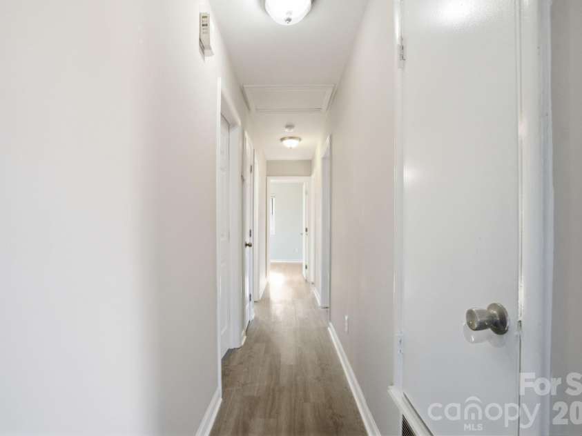 3701 Shoup Court, Charlotte, NC 28216.  MLS# CAR4342902, YatesRealty ID 8413. Going down the hall.