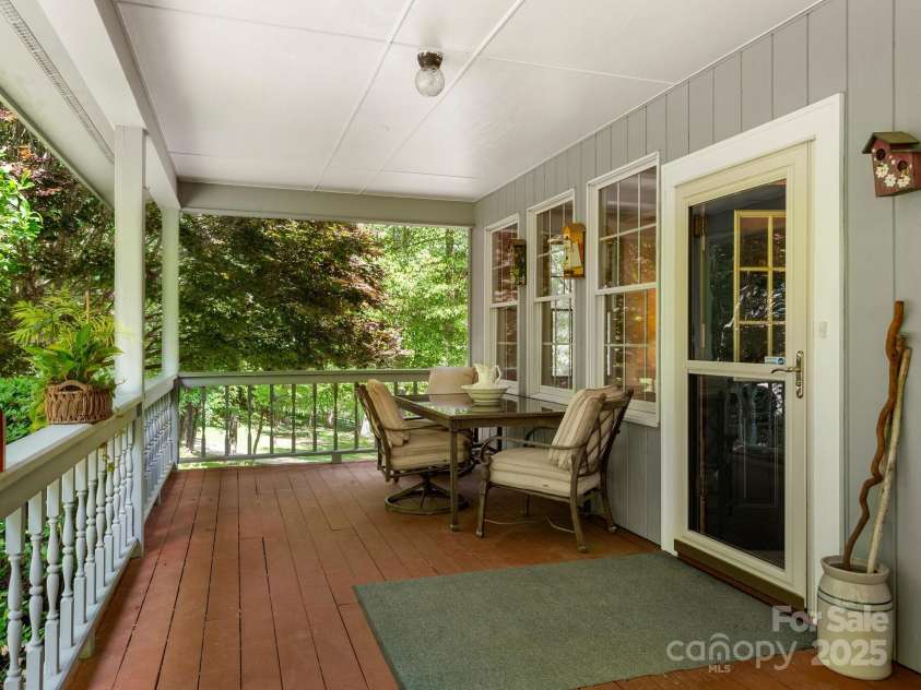 116 Sams Branch Road, Candler, NC 28715.  MLS# CAR4137587, YatesRealty ID 8417. Dine al fresco on the front porch or back.