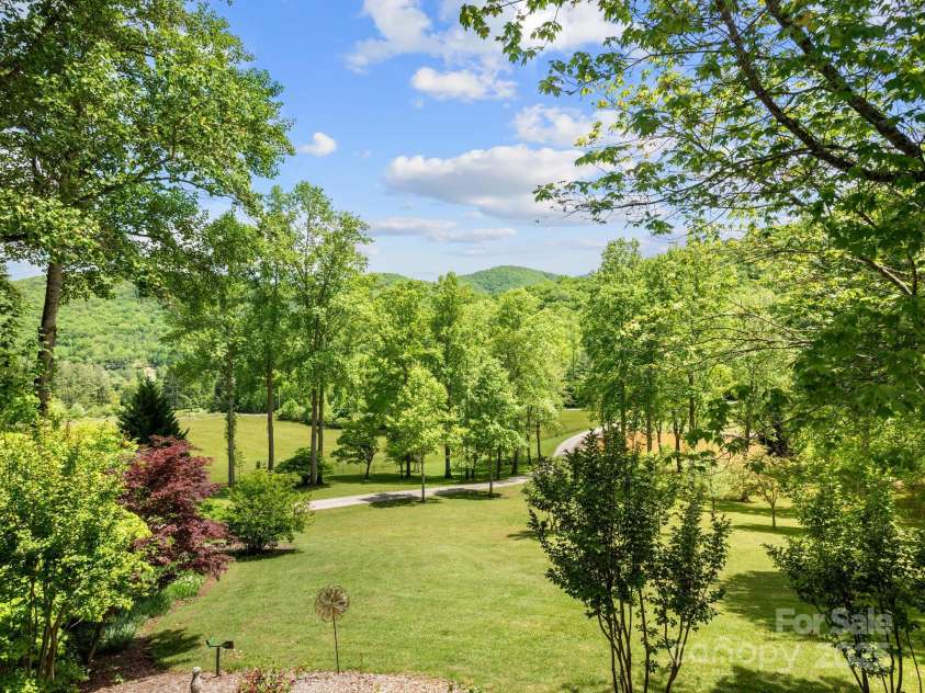 116 Sams Branch Road, Candler, NC 28715.  MLS# CAR4137587, YatesRealty ID 8417. Gorgeous grounds