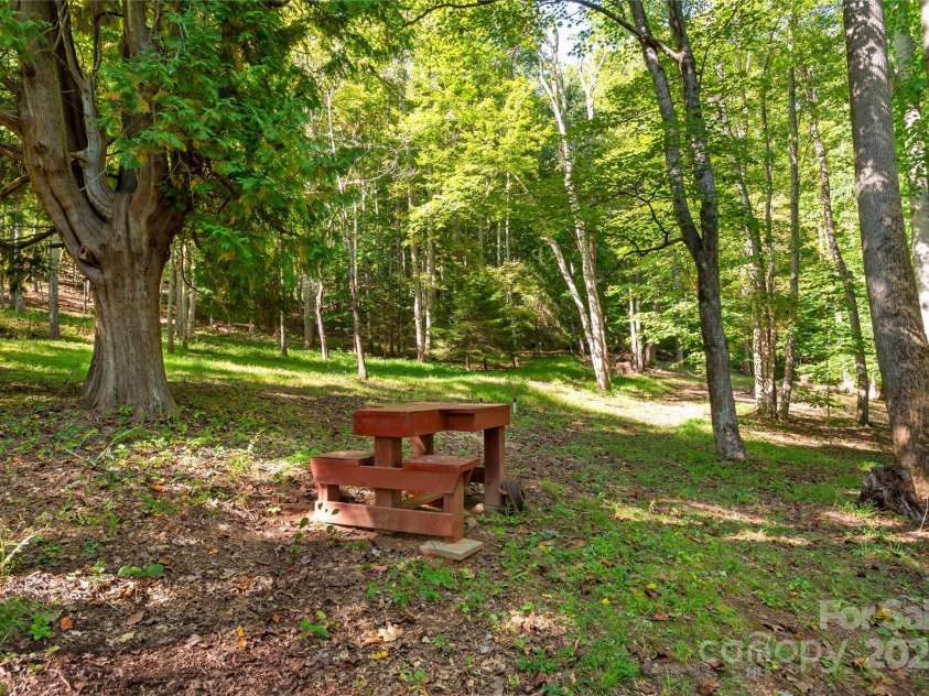 116 Sams Branch Road, Candler, NC 28715.  MLS# CAR4137587, YatesRealty ID 8417. Shooting Bench