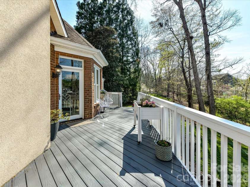 1320 Hudson Place, Davidson, NC 28036.  MLS# CAR4360257, YatesRealty ID 8419. Back deck overlooking the backyard