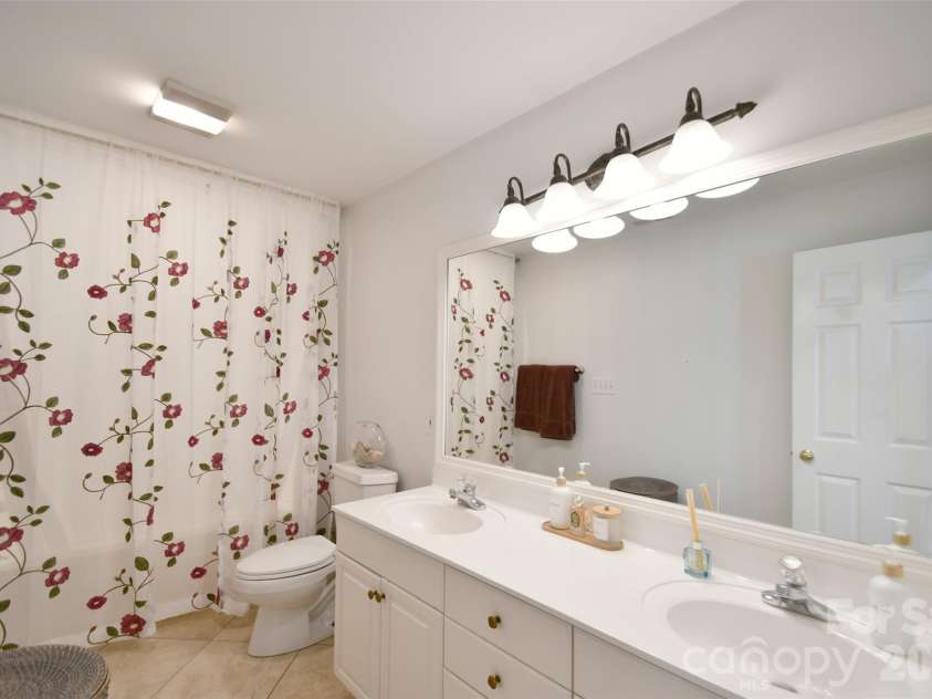 1320 Hudson Place, Davidson, NC 28036.  MLS# CAR4360257, YatesRealty ID 8419. Full bathroom upstairs with two vanities