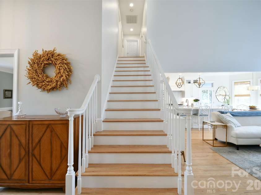 1320 Hudson Place, Davidson, NC 28036.  MLS# CAR4360257, YatesRealty ID 8419. Hardwood stairs leading upstairs