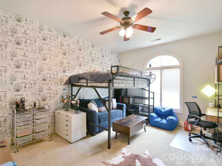 1320 Hudson Place, Davidson, NC 28036.  MLS# CAR4360257, YatesRealty ID 8419. Large Bedroom #2 with tall ceilings and a large, arched window